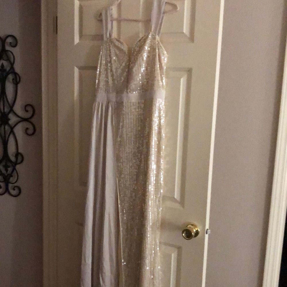 Long sequin dress with straps. Creamy gold color. Right front slit.